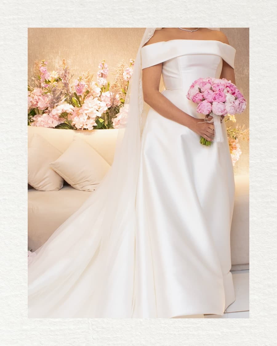 Elegant bridal gown detail with flowing fabric